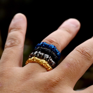 Vintage stainless steel skull rings in gold, silver, black, and blue for men's fashion