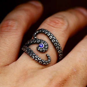 Vintage silver octopus tentacle ring with blue gemstone and polished antique finish
