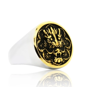 Vintage signet ring in titanium steel featuring a gold lion totem on a wide silver band
