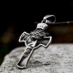 Vintage stainless steel crucifix pendant with detailed Jesus face on a natural stone