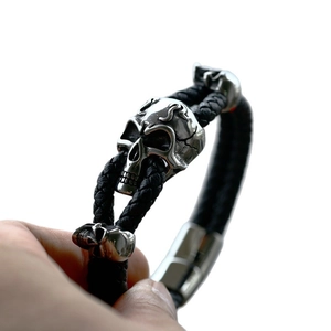 Mens vintage skull bracelet with black braided leather and stainless steel motor charms