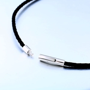 Braided black leather necklace for men featuring a polished stainless steel clasp closure