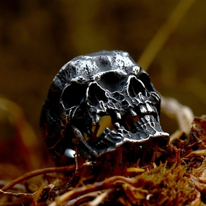 Punk style double skull ring in vintage cast stainless steel with gothic oxidized finish