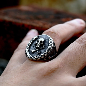 Vintage stainless steel skull signet ring with laurel wreath and anchor engravings