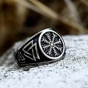 Viking compass stainless steel ring for men with Valknut symbol on a stone base