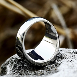 Vintage Viking stainless steel ring for men featuring a Valknut compass emblem on a rock