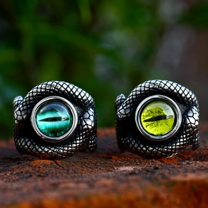Vintage stainless steel snake rings with green and yellow evil eye stones in punk style