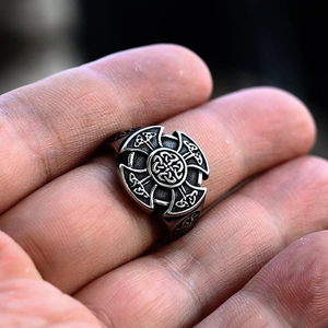 Detailed macro shot of vintage Celtic Knot engraving on a silver stainless steel ring