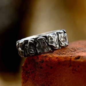 Vintage Viking style stainless steel ring with rugged lava texture and dark metal finish