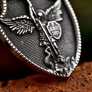 Retro stainless steel shield necklace featuring archangel Michael relief carving