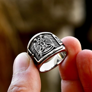 Detailed macro view of vintage stainless steel Masonic ring with 32nd degree double eagle emblem