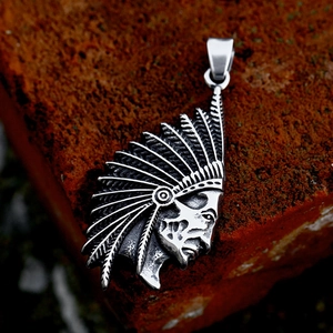Vintage stainless steel Indian chief pendant with feathered headdress on red stone