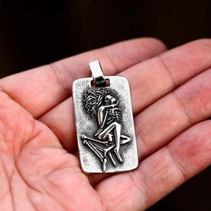 Vintage stainless steel rectangular pendant featuring high-relief gothic skeleton design