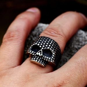 Vintage punk rock skull ring in distressed stainless steel with silver dotted texture