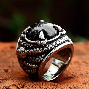 Vintage stainless steel snake-scale ring featuring a black stone set in dragon claws