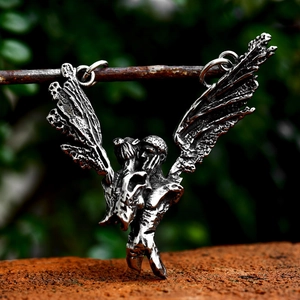 Vintage oxidized silver angel wings pendant featuring embracing lovers on a branch
