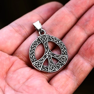 Detailed macro view of stainless steel Celtic Knot peace pendant with vintage finish