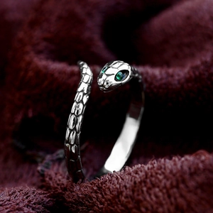 Retro stainless steel snake ring with green gemstone eyes and detailed scale texture