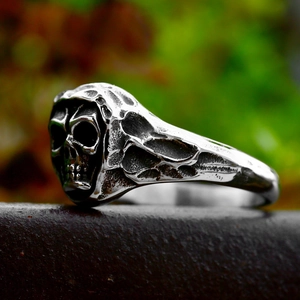 Vintage gothic punk skull ring in oxidized stainless steel with distressed metal texture