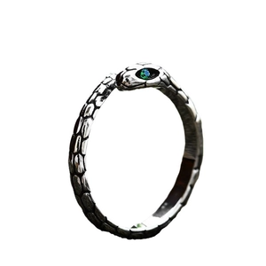 Vintage stainless steel snake ring with green gemstone eye and scale texture