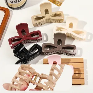 Large soft rubber bow claw clips in various solid colors for thick hair styling