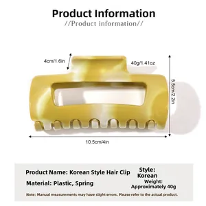 Détail de la pince à cheveux marbrée jaune-vert avec dimensions 10,5 cm x 5,5 cm