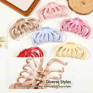 Large matte silicone hair claw clips in various marble colors for thick hair styling