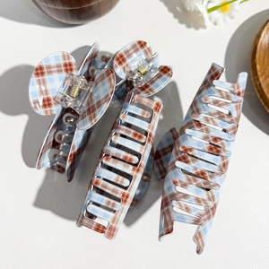 Three-piece set of brown and blue plaid hair claws with gold springs and glossy finish