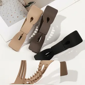 Grandes pinces à cheveux mates en forme de nœud en beige, marron et noir pour femmes