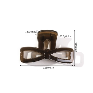 Brown translucent bow hair claw clip made of resin with 9.5cm dimensions and metal spring