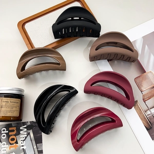 Set of six large matte and glossy shark hair claws with a minimalist semi-circular design