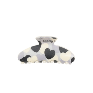 Semicircle hair claw clip with heart patterns and lovely text on a white background