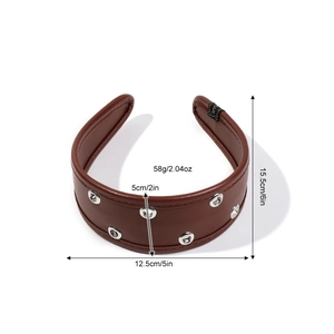 Brown faux leather headband with silver eyelets and padded retro punk style design