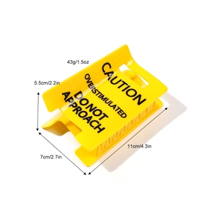 Yellow hair claw clip with black Caution Overstimulated warning text on white background