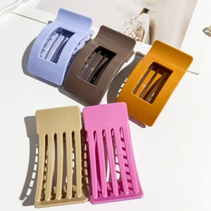 Detail of 9.5cm rectangular matte hair claws in purple, brown, yellow, khaki, and pink colors