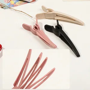 Volumizing root clips for hair styling in beige, pink, and black matte finish