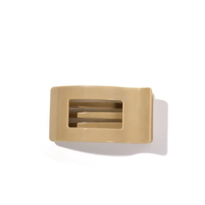 Minimalist 9.5cm hollow rectangular hair claw clip in beige silicone finish on white background