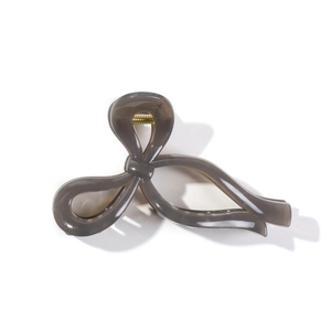 Elegant taupe jelly bow hair claw clip with gold spring for women's minimalist styling