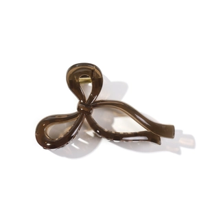 Elegant translucent brown bow hair claw clip with gold spring for women hair styling