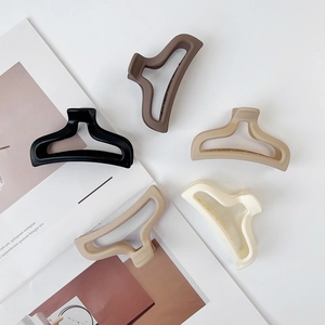 Set of five matte cream mermaid tail hair claws in neutral earth tones with hollow design