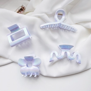Iridescent white pearl hair claw clip set for women with glossy finish on soft fabric