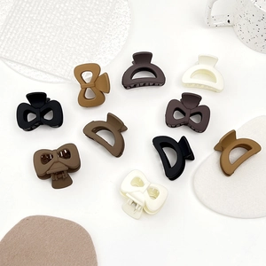 Matte finish small hair clips in earth tones including bow and arc designs for women