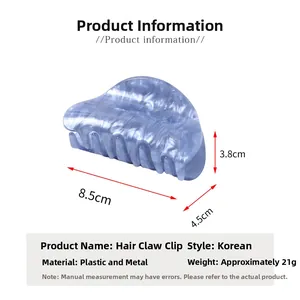 Detail view of light blue marble acrylic hair claw clip with specific size measurements