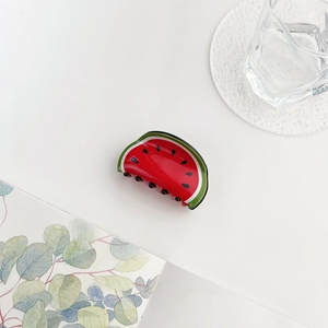 Detailed top view of a cute acrylic watermelon hair claw clip with vibrant summer vibes
