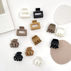 Mini matte bow hair claw clips set in neutral colors for high ponytail hairstyles