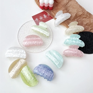 Chic acrylic hair claws with marble water ripple pattern in various pastel colors
