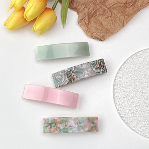Set of four rectangular acetate hair clips in solid pastel and marble floral patterns