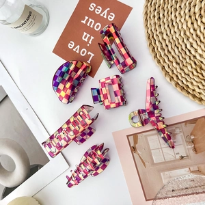 Geometric iridescent checkered hair claw set featuring various shapes on aesthetic background