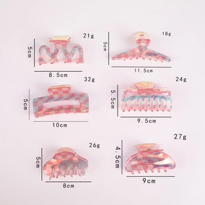 Pink checkered acetic acid geometric hair claws set with measurements on white background