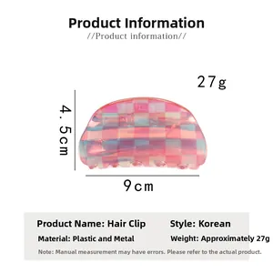 Detail view of 9cm pink and blue checkered hair claw clip with iridescent finish
